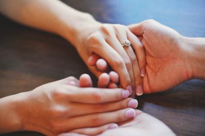 holding-hands-across-table